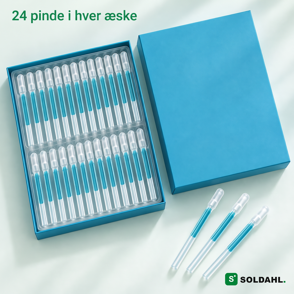 Åben æske med 24 pinde i bakke og tre løse pinde, teksten 24 pinde i hver æske