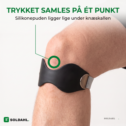 Trykket samles på ét punkt lige under knæskallen